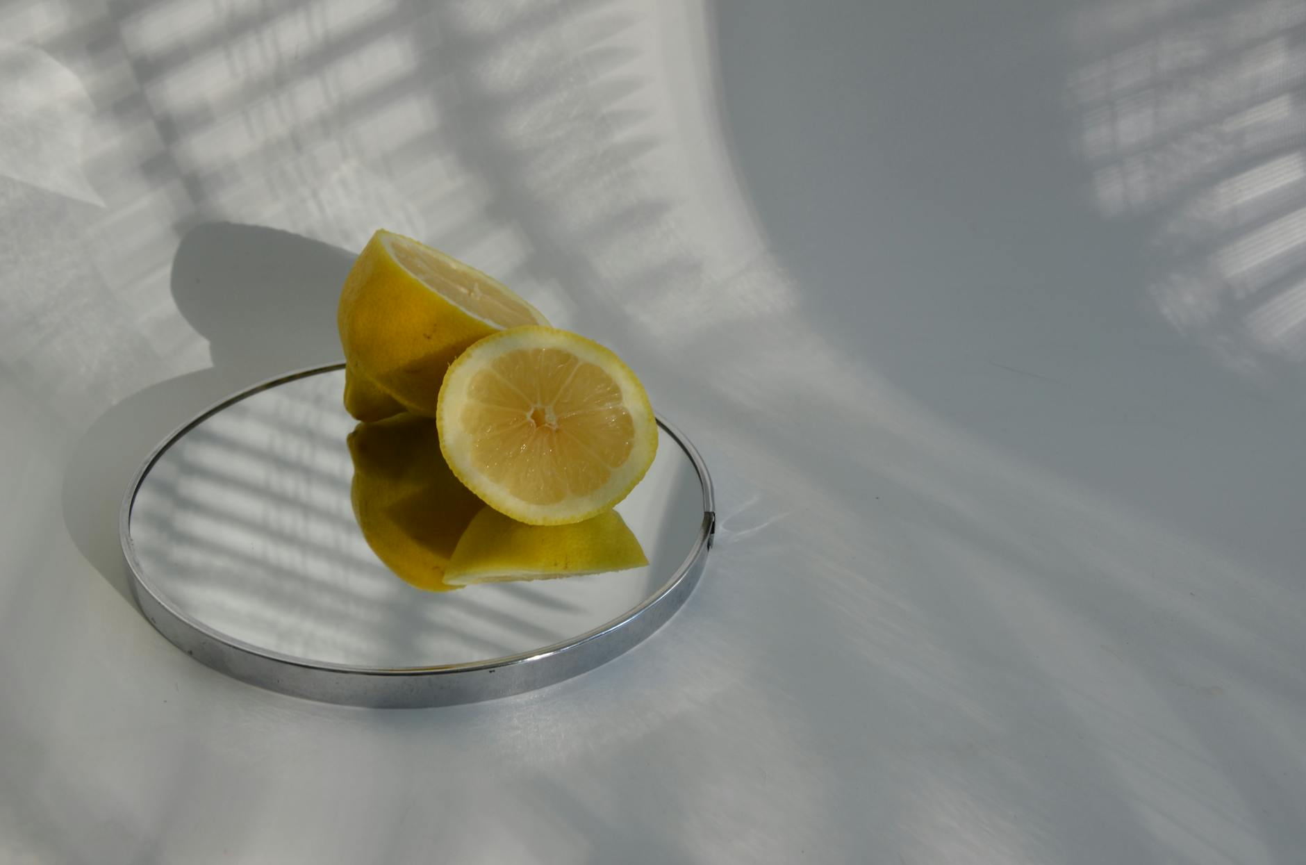 Fresh lemons held in cupped hands on a brown surface, symbolizing renewal and freshness during intimate self-care